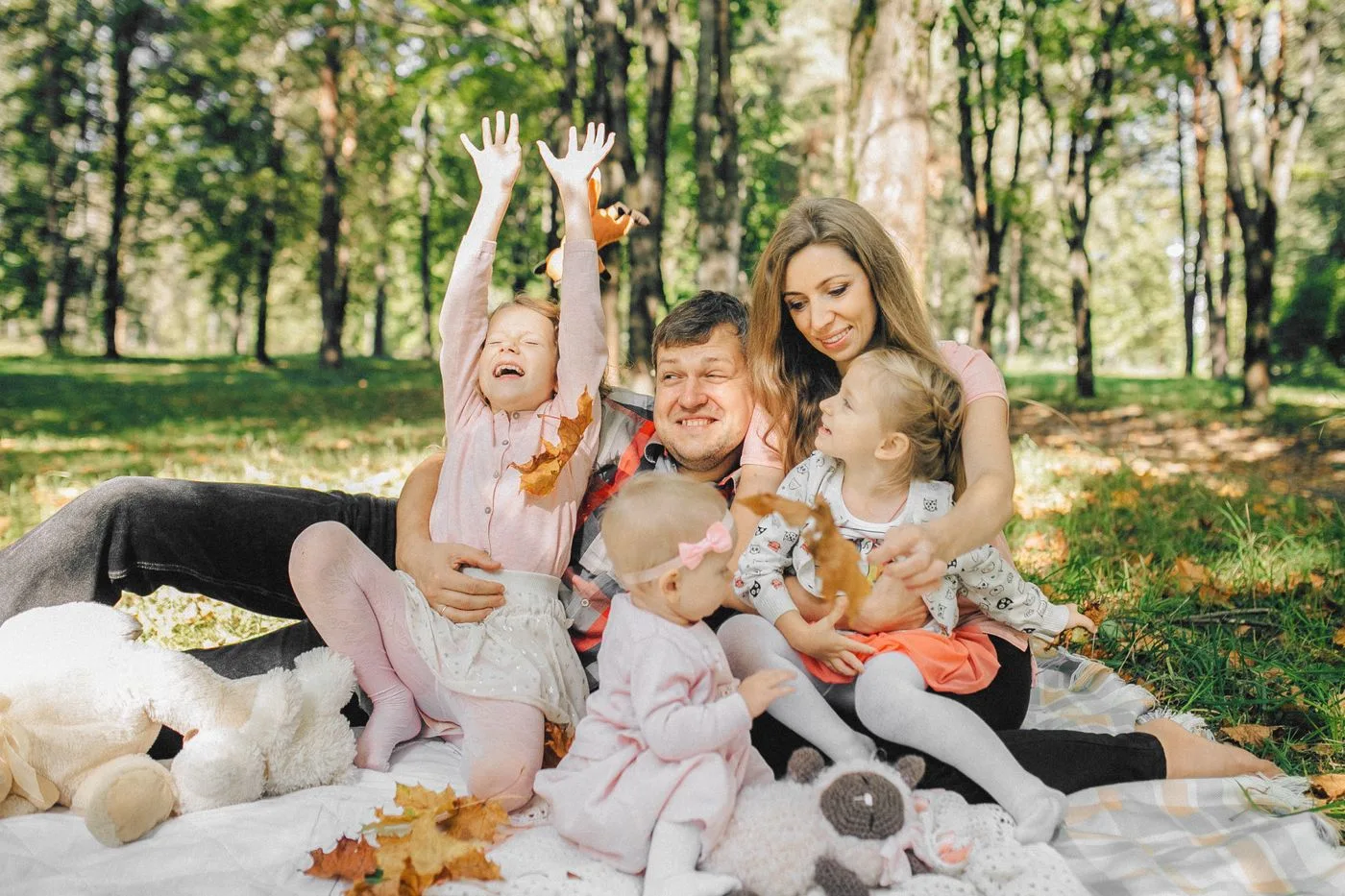A family spending time together on a picnic blanket